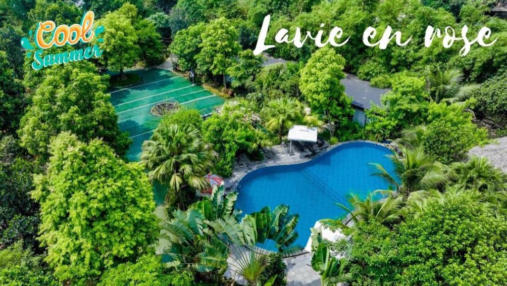 an aerial view of a resort with two pools at La Vie En Rose Ba Vì Homestay in Hanoi