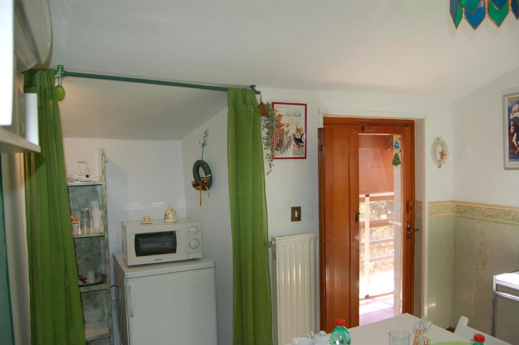 Kuchyň nebo kuchyňský kout v ubytování Le Coin Vert