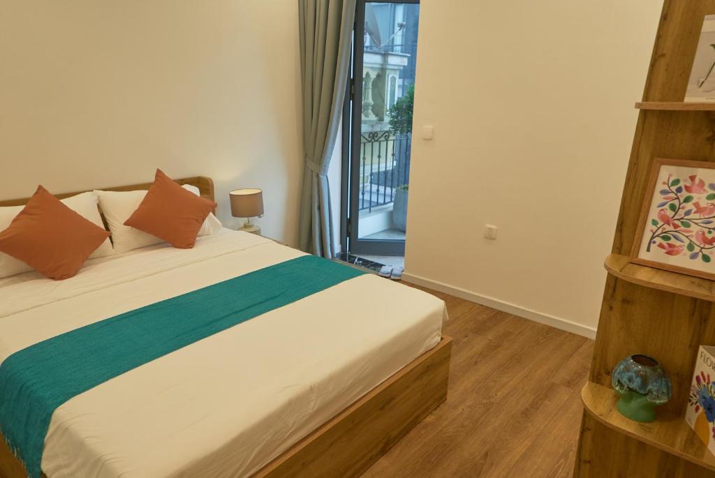 Postel nebo postele na pokoji v ubytování Hanoi Shouten - Staycation