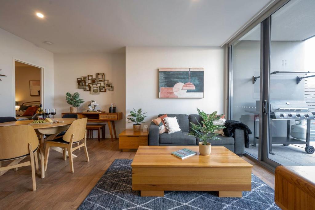 a living room with a couch and a table at Eastside apartment in Charlestown