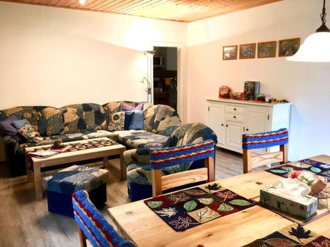 a living room with a couch and a table at Holiday home Tachbachtal in Themar