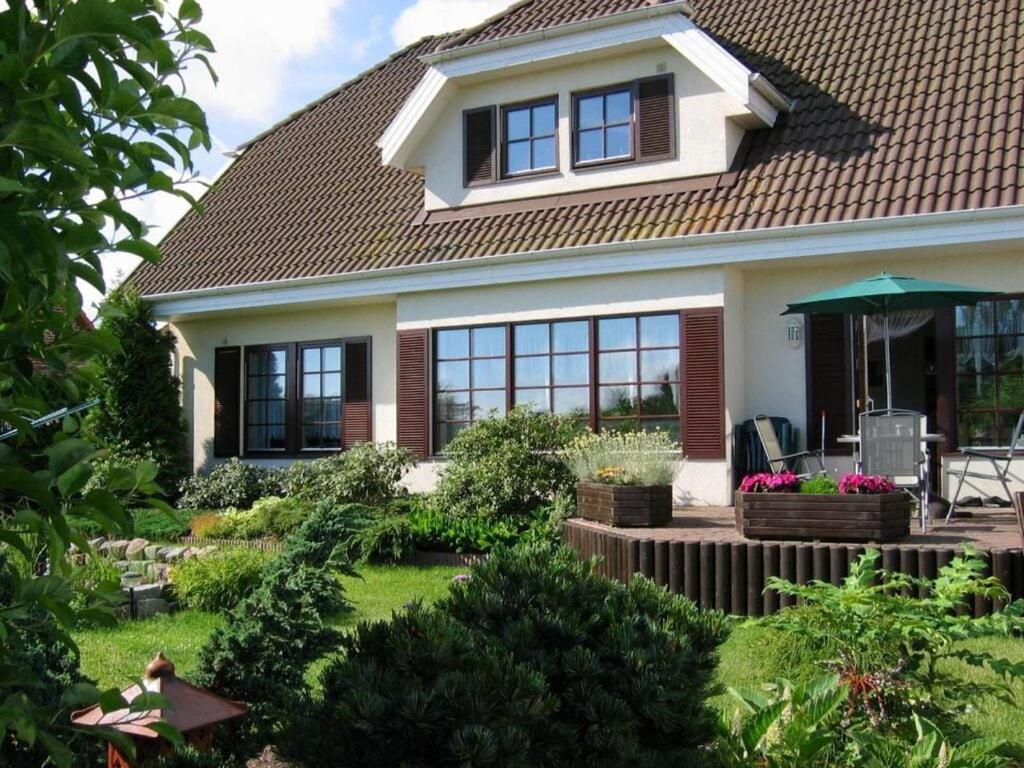 a house with a garden in front of it at In the Szczecin Lagoon Nature Park in Ueckermünde