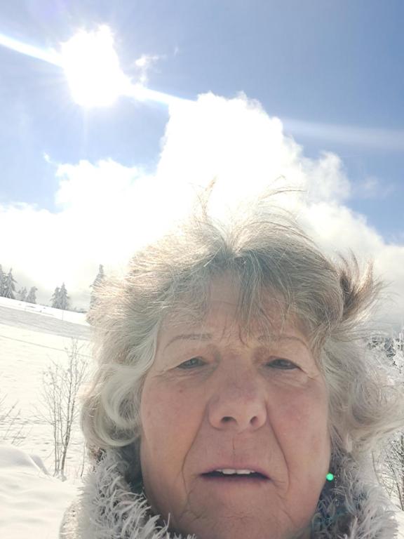 an older woman standing in the snow at Parkhotel an der Therme in Herbolzheim