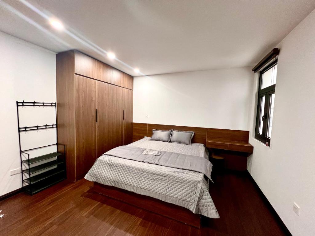 Säng eller sängar i ett rum på HPT Apartment chuỗi căn hộ Hoàng Huy Riverside HP