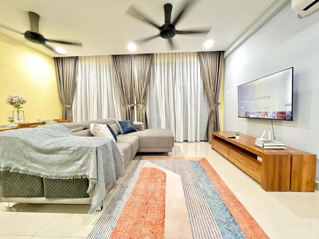 a living room with a couch and a flat screen tv at D'Chill Suite【Austin Regency】Netflix in Johor Bahru