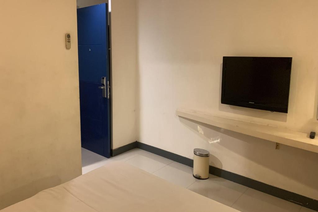 TV a/nebo společenská místnost v ubytování Hotel Glodok Plaza