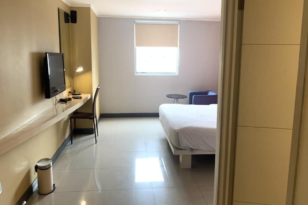 TV a/nebo společenská místnost v ubytování Hotel Glodok Plaza