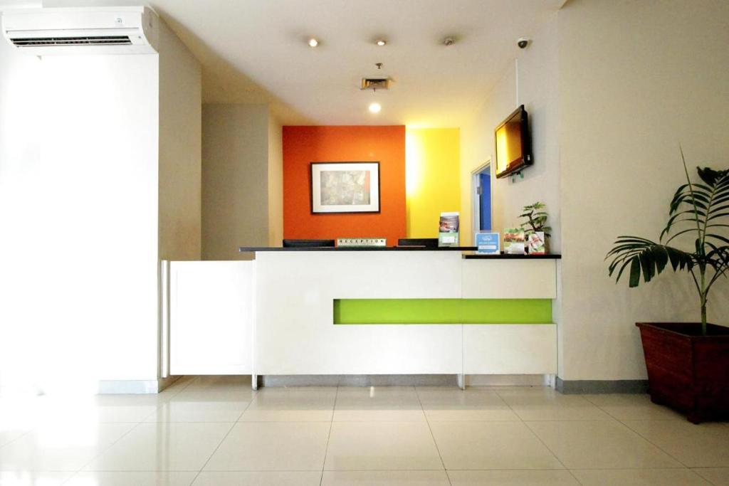 TV a/nebo společenská místnost v ubytování Hotel Glodok Plaza