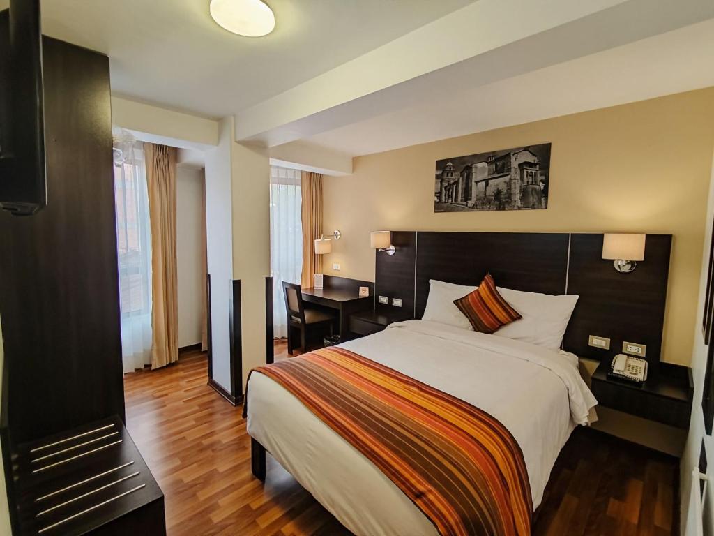 Postel nebo postele na pokoji v ubytování Royal Inn Cusco Hotel