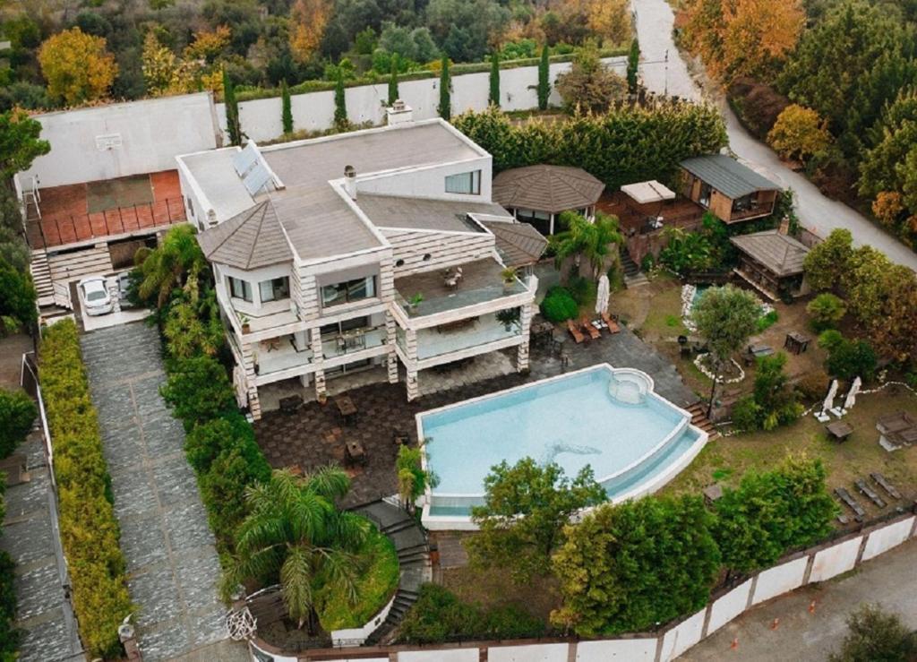 an aerial view of a house with a swimming pool at Doors Urla Hotel & Bungalows in İzmir