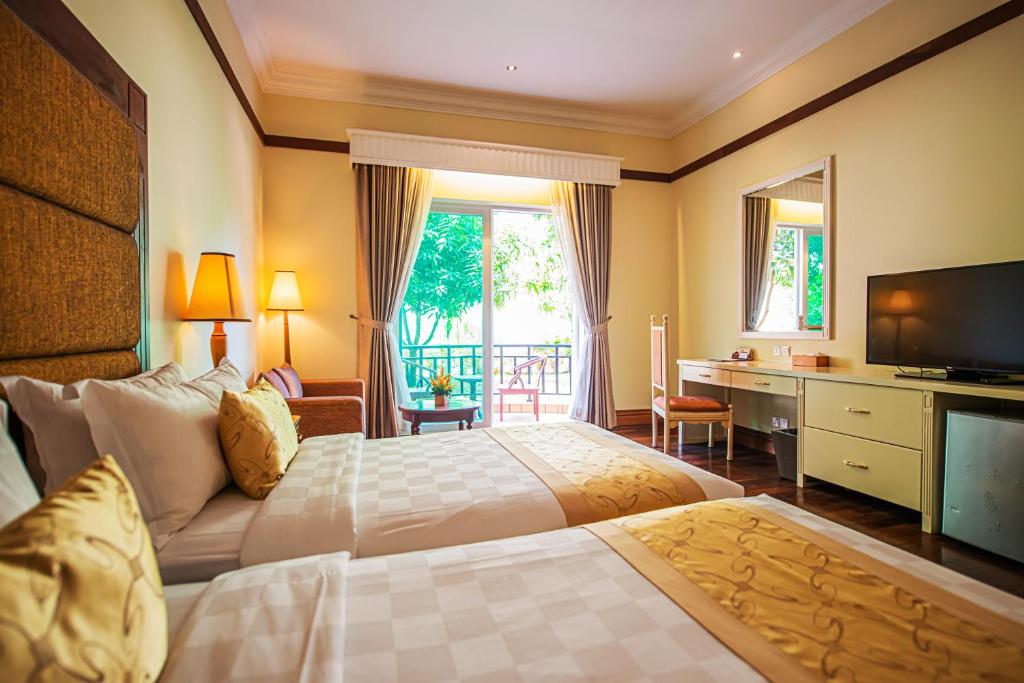 Postel nebo postele na pokoji v ubytování Sokha Siem Reap Resort & Convention Center