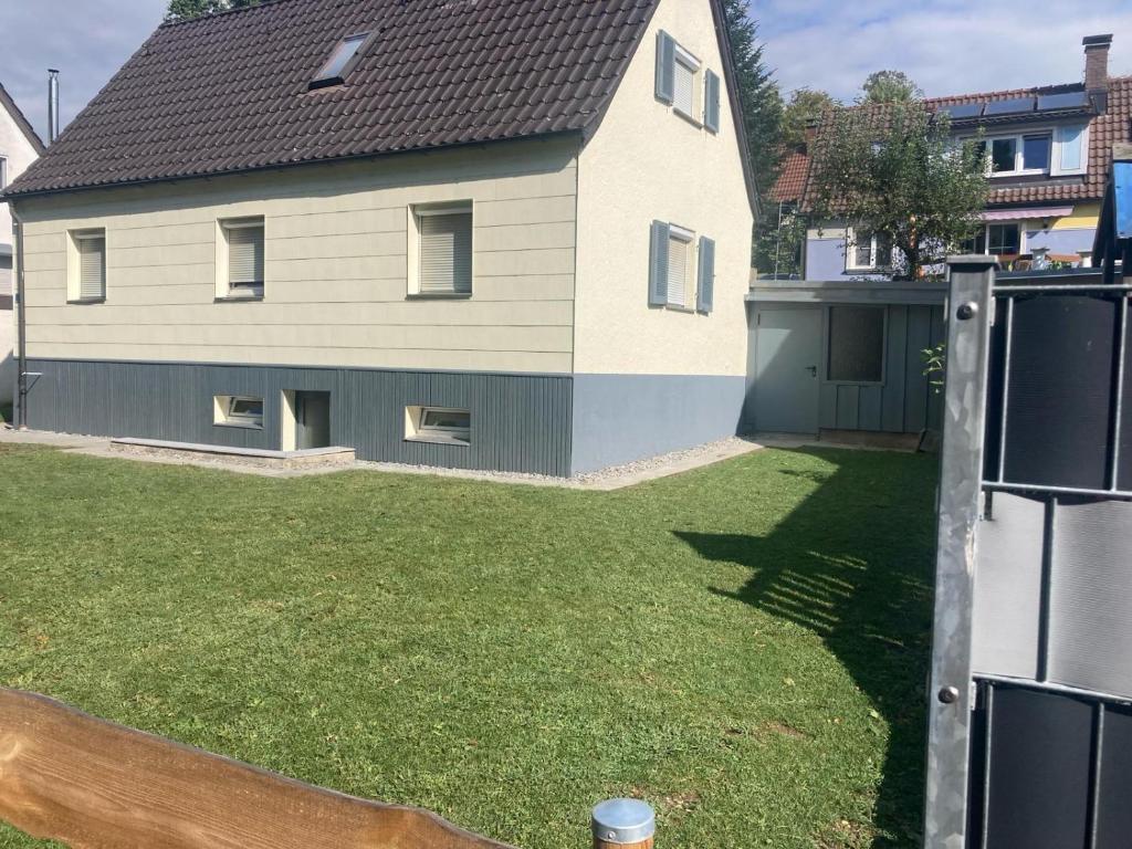 a large house with a yard with a house at HummelHaus 3 in Lindau in Lindau