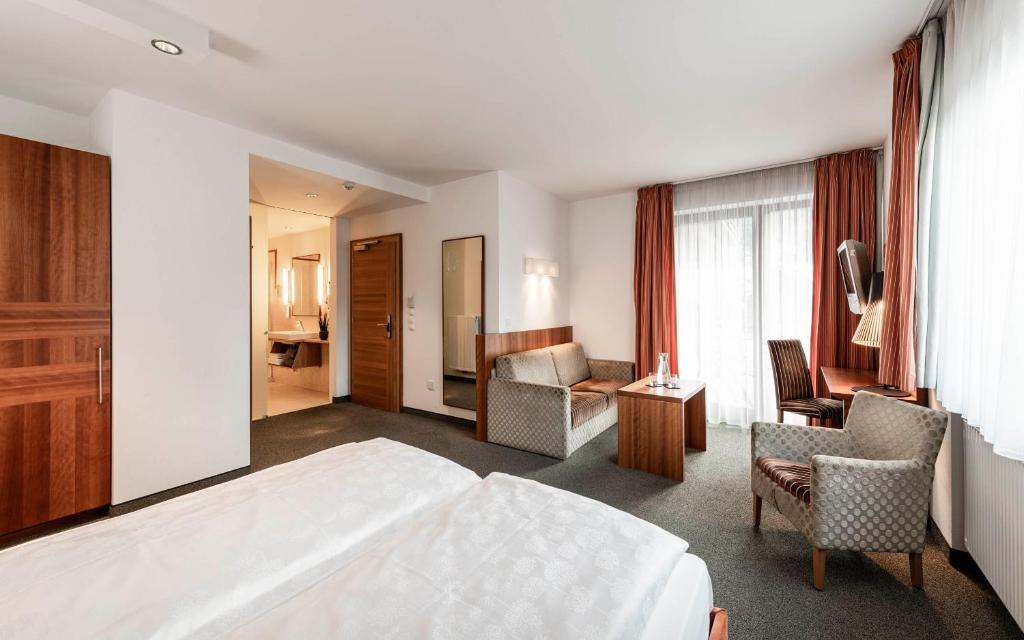 Postel nebo postele na pokoji v ubytování Hotel Clara