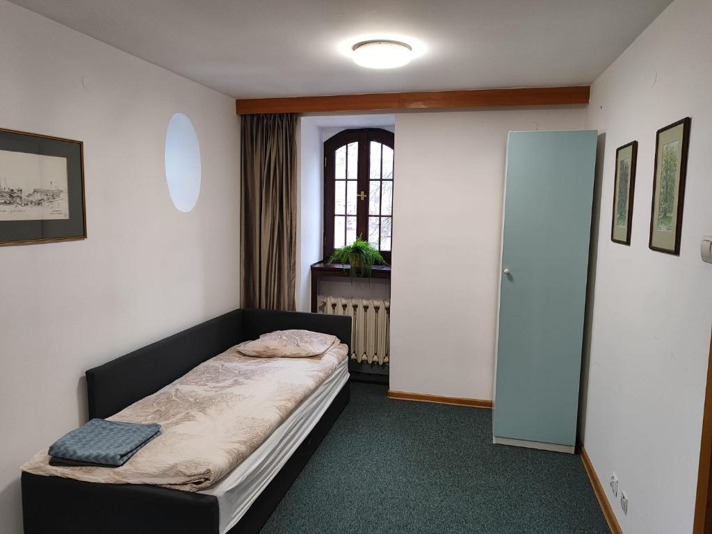 a small bedroom with a bed in a room at Apartament dla dwóch osób - Piotrkowska 262-264 pok A101 in Łódź