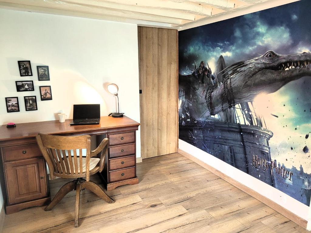 an office with a dinosaur mural on the wall at ☆ La Demeure des Maraudeurs ☆ Décoration Harry Potter ☆ Proche Disneyland ☆ Family ☆ Quite ☆ Netflix &amp; Disney+ ☆ in Villiers-sur-Morin
