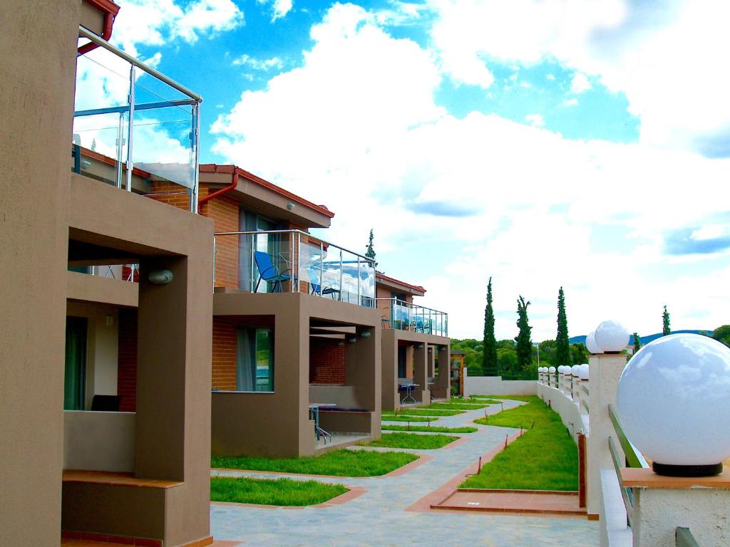 Village Mare Residences logo