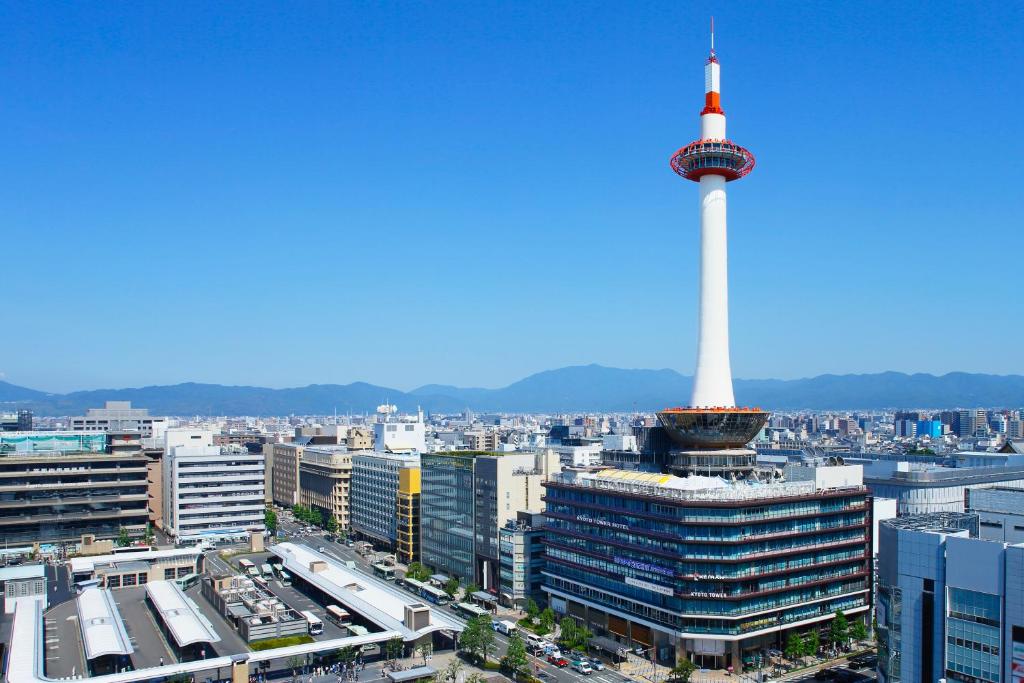 a view of a city with a tv tower at Kyoto Tower Hotel in Kyoto