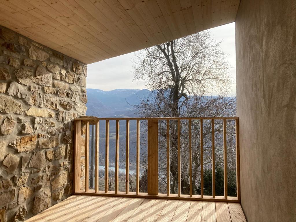 a room with a balcony with a view of the mountains at Casa nella natura a Bobbio in Bobbio