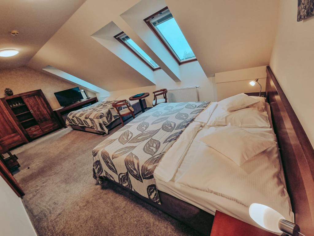 Postel nebo postele na pokoji v ubytování Hotel Mario