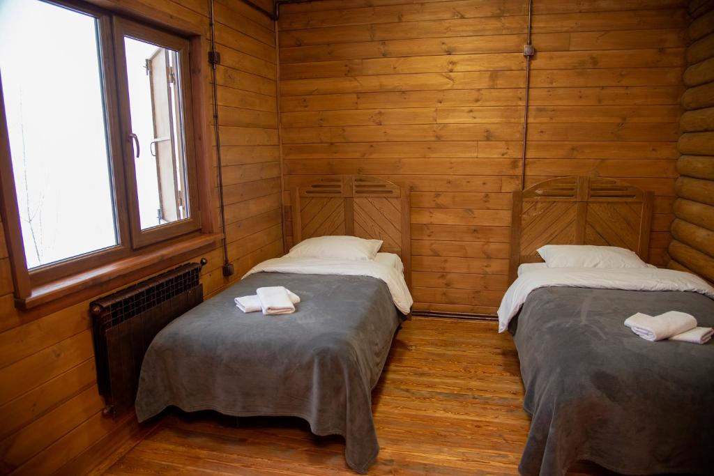 Postel nebo postele na pokoji v ubytování Ranger Campus Eco Lodge