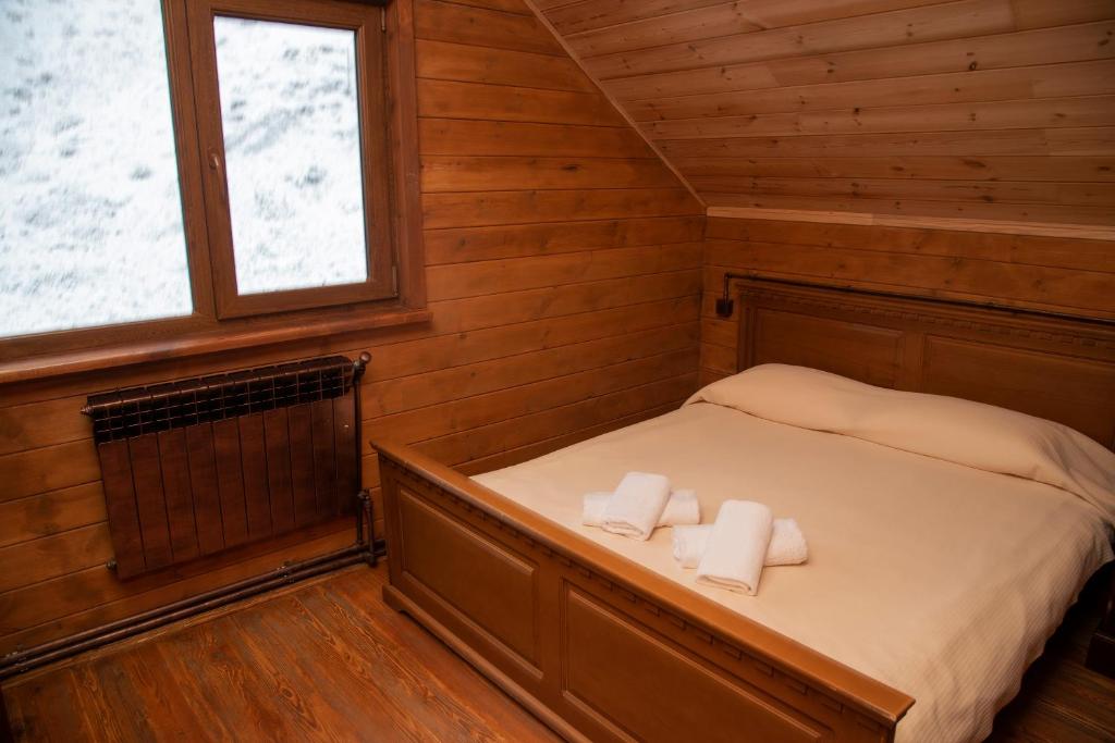 Postel nebo postele na pokoji v ubytování Ranger Campus Eco Lodge