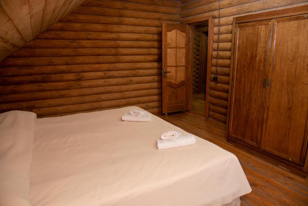 Postel nebo postele na pokoji v ubytování Ranger Campus Eco Lodge