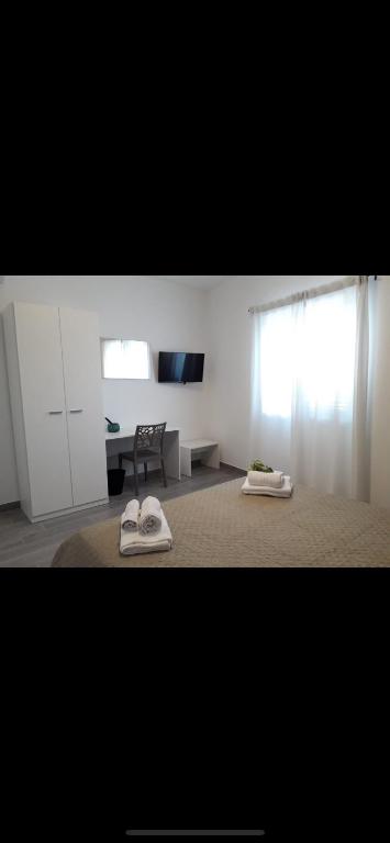 TV a/nebo společenská místnost v ubytování L'Antico Borgo B&B