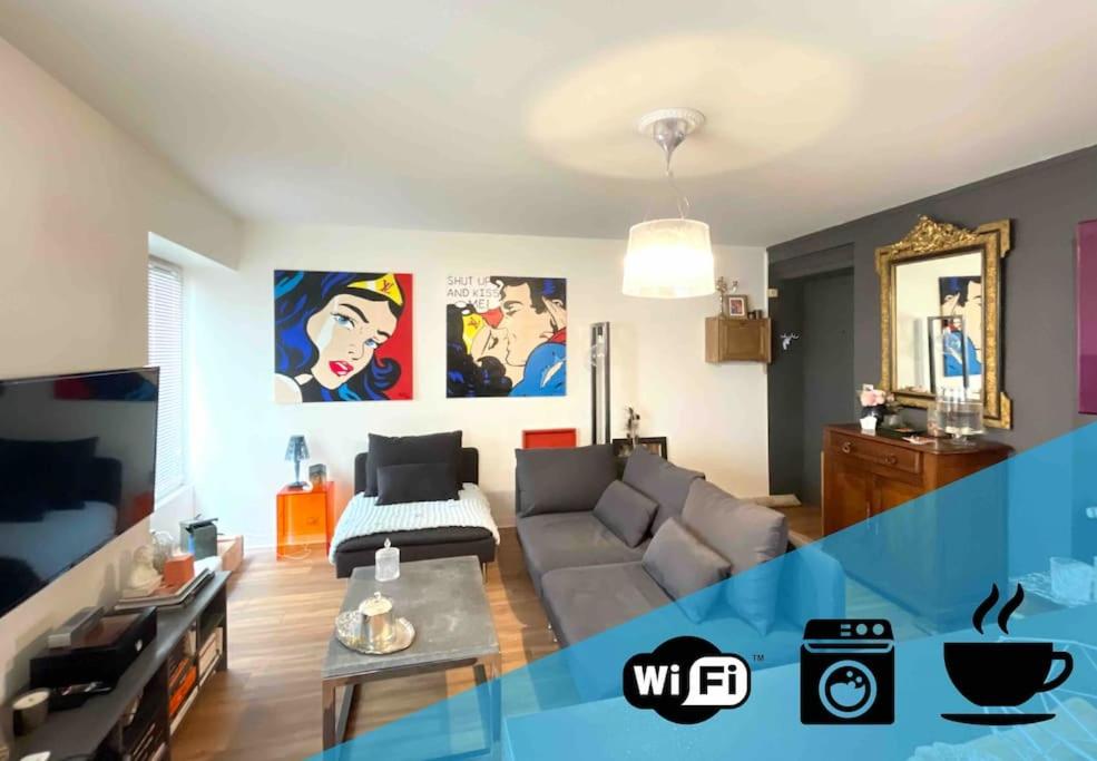 a living room with a couch and a table at 22 COEUR DE VIENNE in Vienne