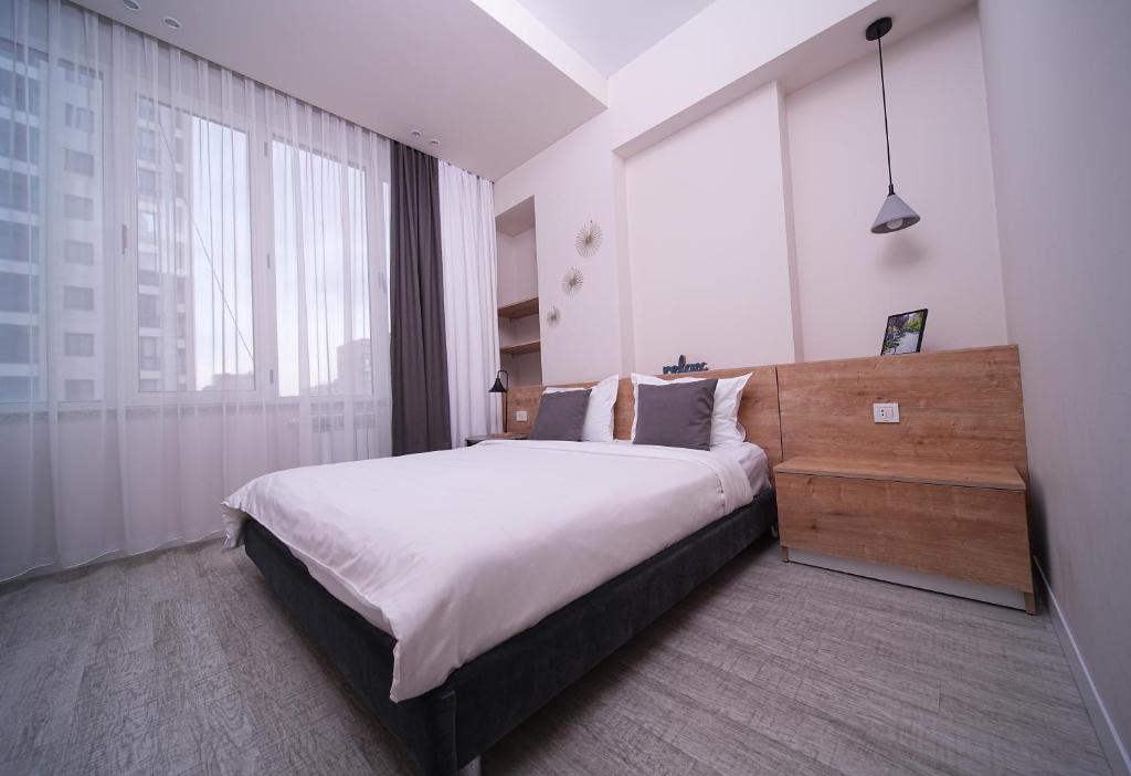 Postel nebo postele na pokoji v ubytování Sweet Home Apart-Hotel