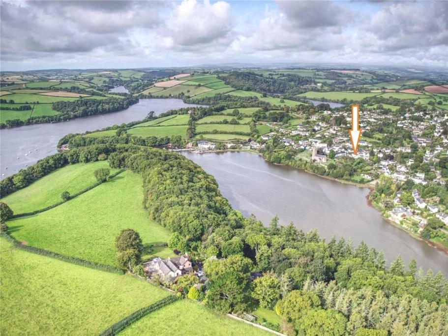 an aerial view of a river and a city at The Post House (Centre of riverside village) in Stoke Gabriel