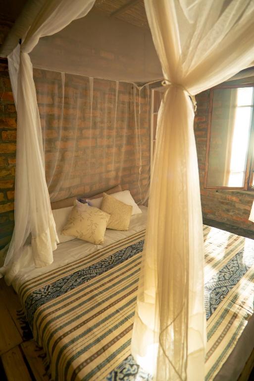 Postel nebo postele na pokoji v ubytování Inhambane Bay View Home