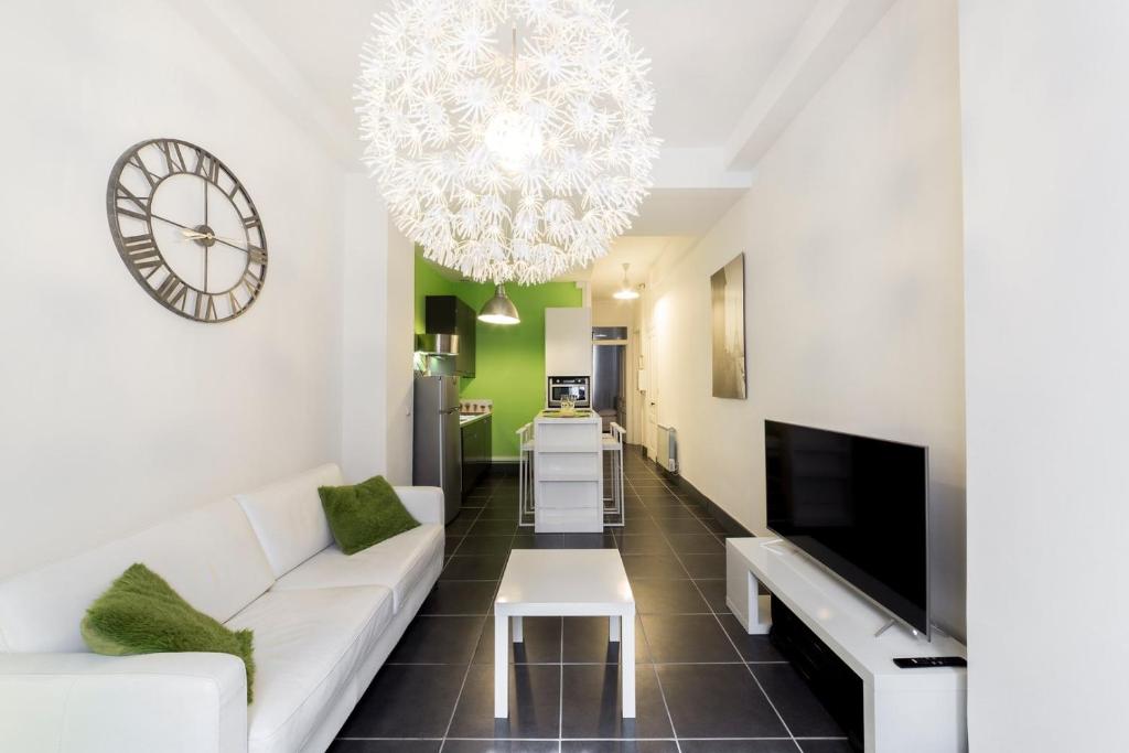 Televízia a/alebo spoločenská miestnosť v ubytovaní Appartement calme - quartier prisé Montchat AIL