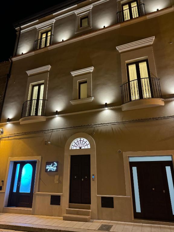 a large building with two balconies on top of it at B&B Palazzo Croghan in Torre Maggiore