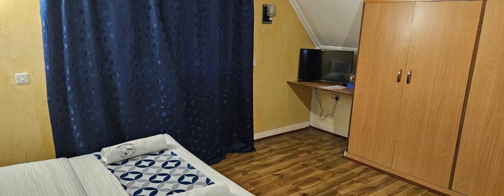 TV a/nebo společenská místnost v ubytování Weavers Haven