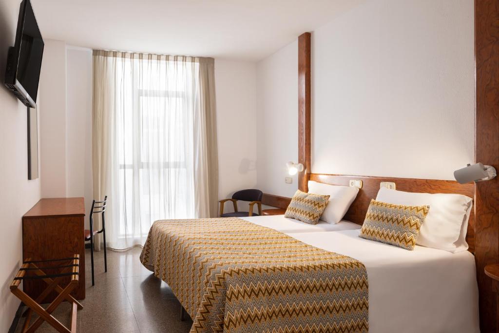 Cama o camas de una habitación en htop Platja Park #htopFun