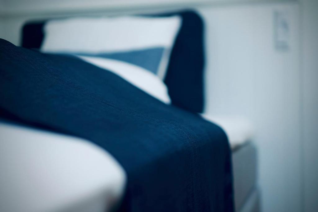 Postel nebo postele na pokoji v ubytování Plesners Badehotel