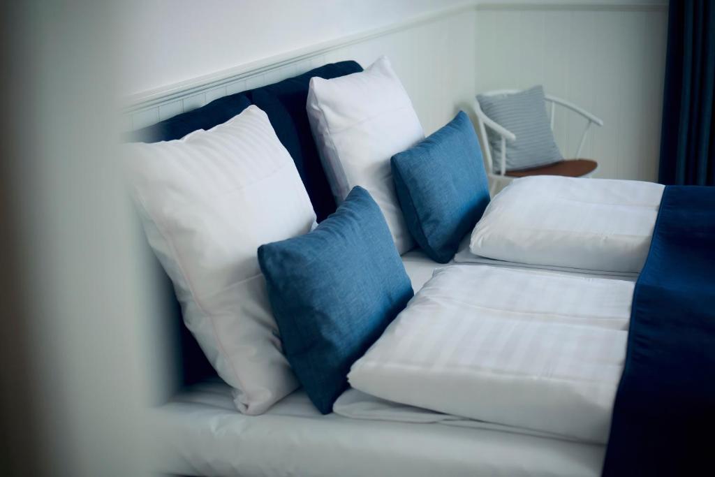 Postel nebo postele na pokoji v ubytování Plesners Badehotel