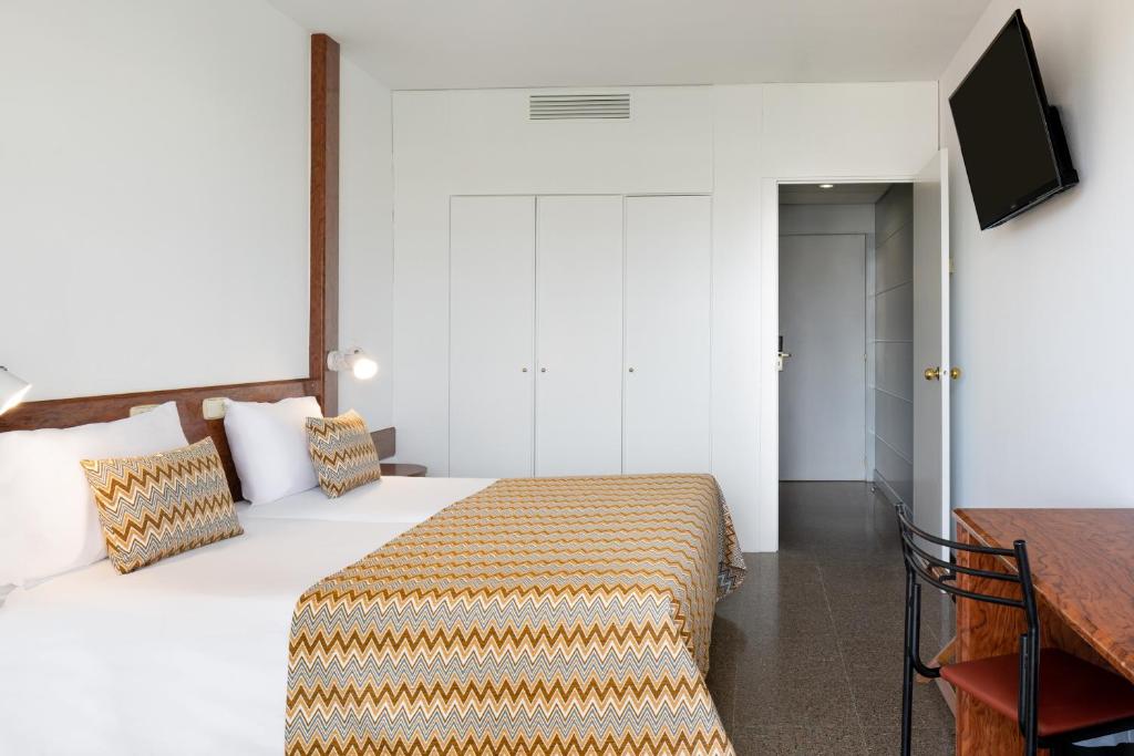 Cama o camas de una habitación en htop Platja Park #htopFun