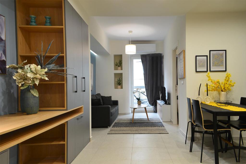 a kitchen and living room with a dining room at T&N Central Amazing Apartment in Thessaloniki