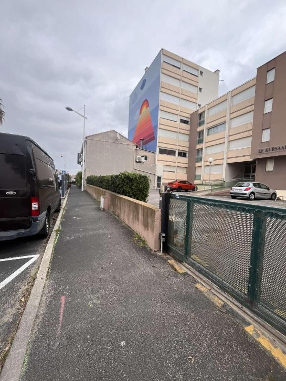 a van parked on a street in front of a building at Superbe Appartement Vue Mer T3 70m2 in Mauguio