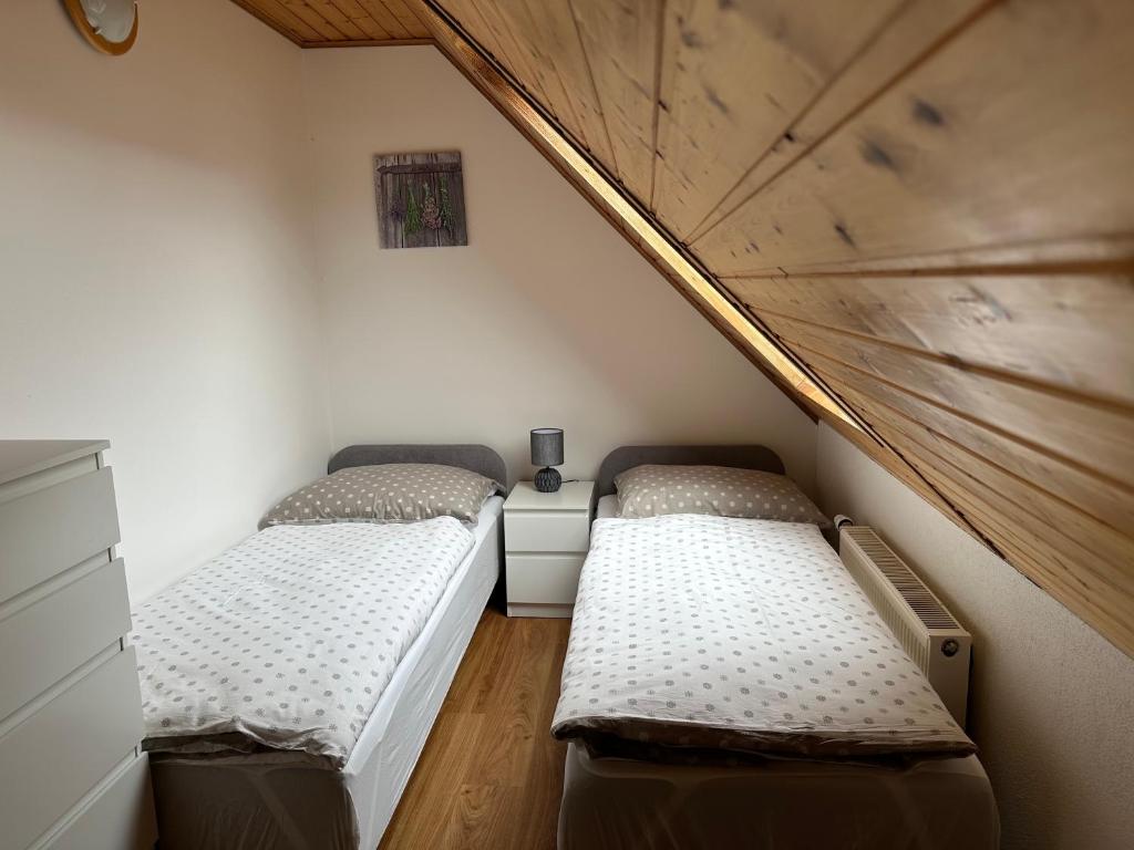 Postel nebo postele na pokoji v ubytování Apartmán Jako u Babičky