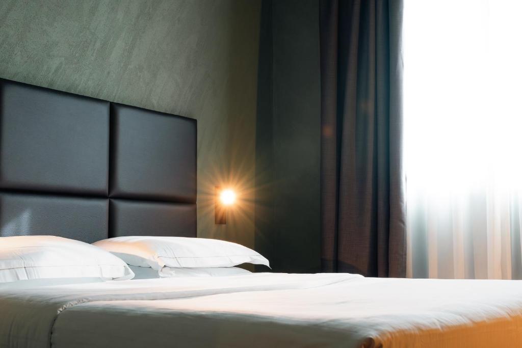 Postel nebo postele na pokoji v ubytování Point Hotel