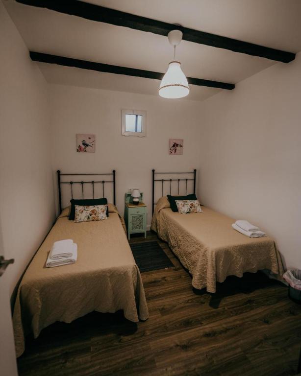 Postel nebo postele na pokoji v ubytování Casa Rural VUT El Rincón de Eulogio