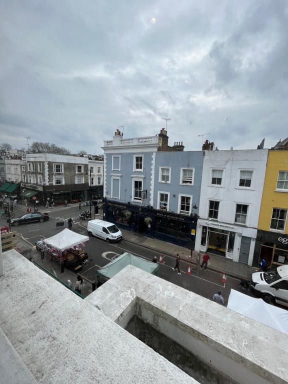 a view of a city street with buildings at Stunning Portobello Road flat in London