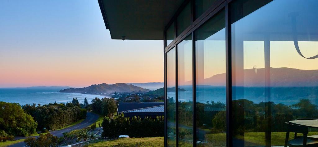 a view of the ocean from a building at ONYX HOUSE - Wainui Beach in Gisborne