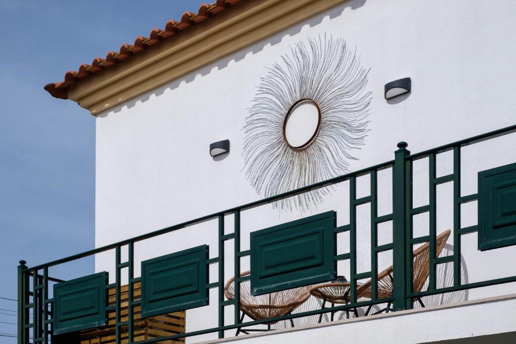 a mural on the side of a building at Casa Idalia Boutique Hotel in Comporta