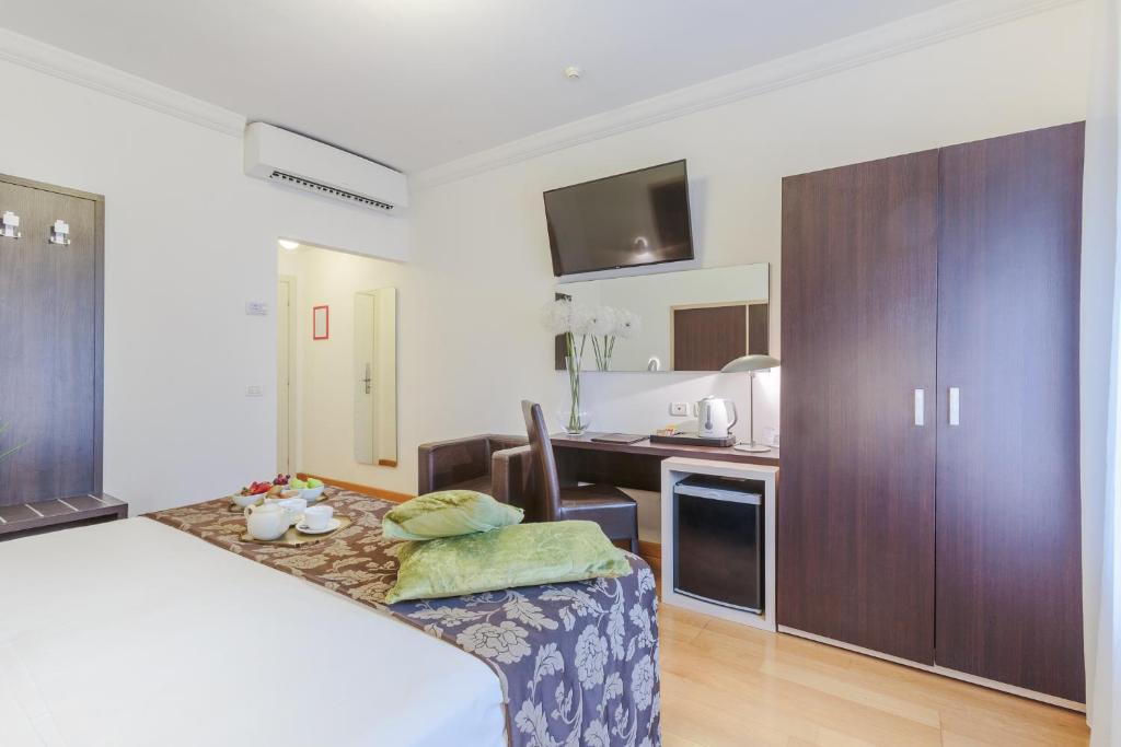 Postel nebo postele na pokoji v ubytování Hotel Hambros - Il Parco in Villa Banchieri