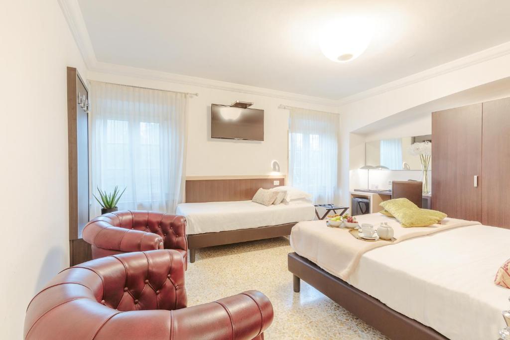 Postel nebo postele na pokoji v ubytování Hotel Hambros - Il Parco in Villa Banchieri