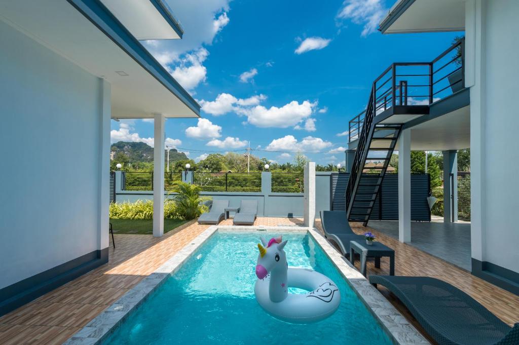 a swimming pool with a unicorn in a house at Lark Pool Villa Aonang Krabi in Ao Nang Beach