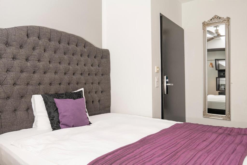 Postel nebo postele na pokoji v ubytování Boutique Hotel Weisses Kreuz - Adult only Hotel